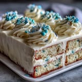 Moist vanilla sheet cake decorated with buttercream and Class of 2026 piping, perfect for graduation celebrations.  