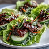 Tender caramelized Korean BBQ beef wraps served with crunchy kimchi and cooling cucumber.