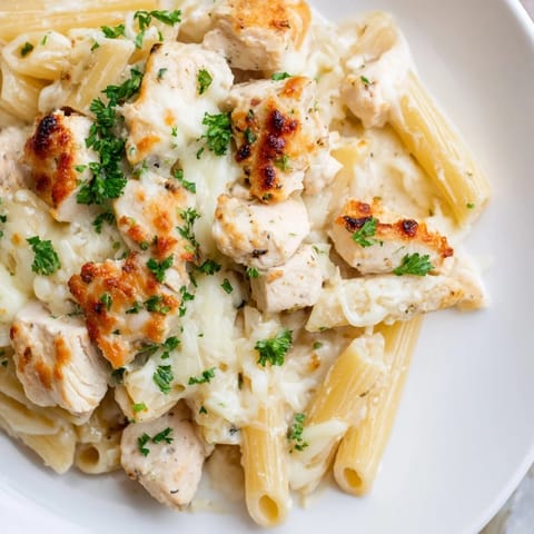 A close-up view of the hearty Chicken Alfredo Bake, baked to perfection, ready to serve.